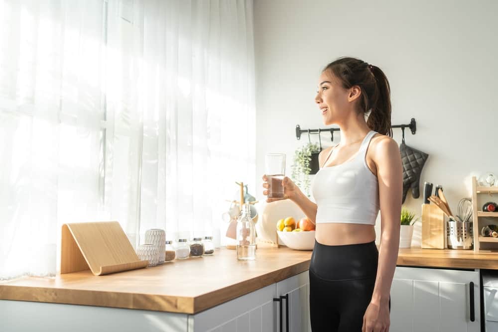 asian woman drinking water
